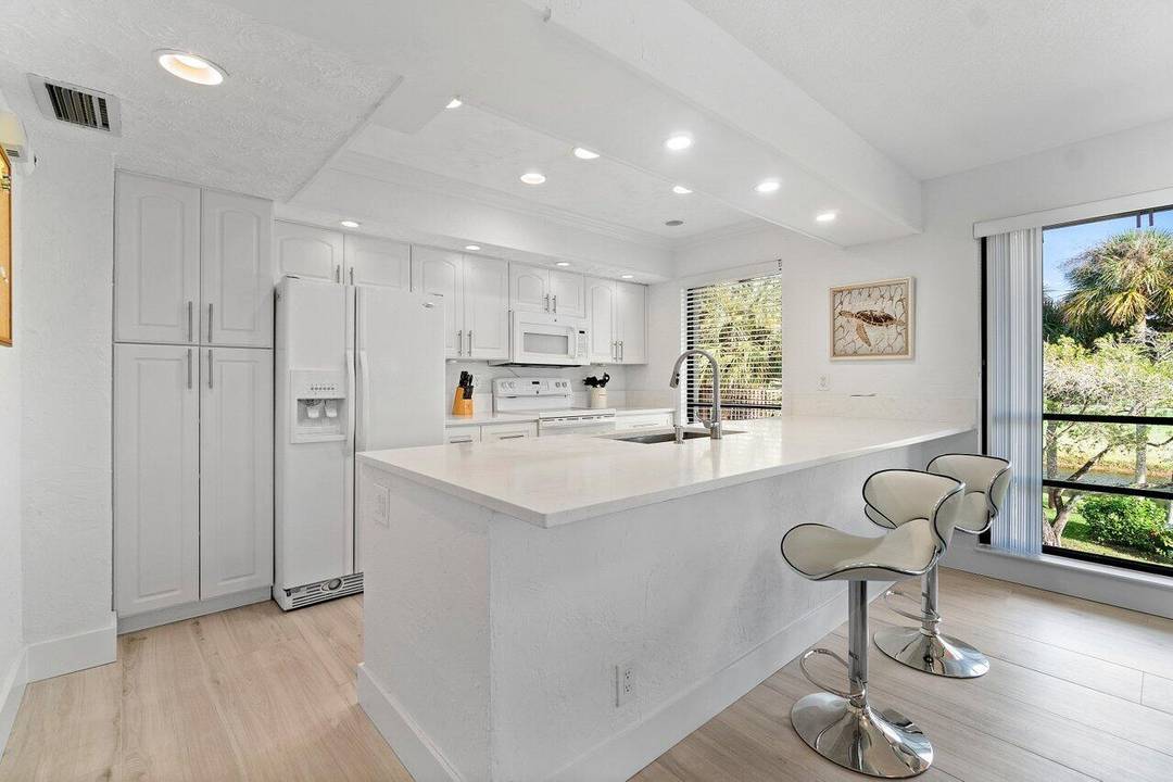 Enjoy the peaceful living in this bright, furnished, and tastefully renovated 2 bedroom, 2 bath condo on a private 2nd floor walk up.