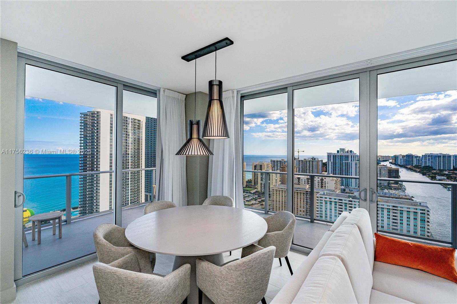 Rare 2 bed, 2 bath Southeast corner unit at Hyde Beach House with a spacious wraparound balcony showcasing breathtaking ocean, city, and Intracoastal views.