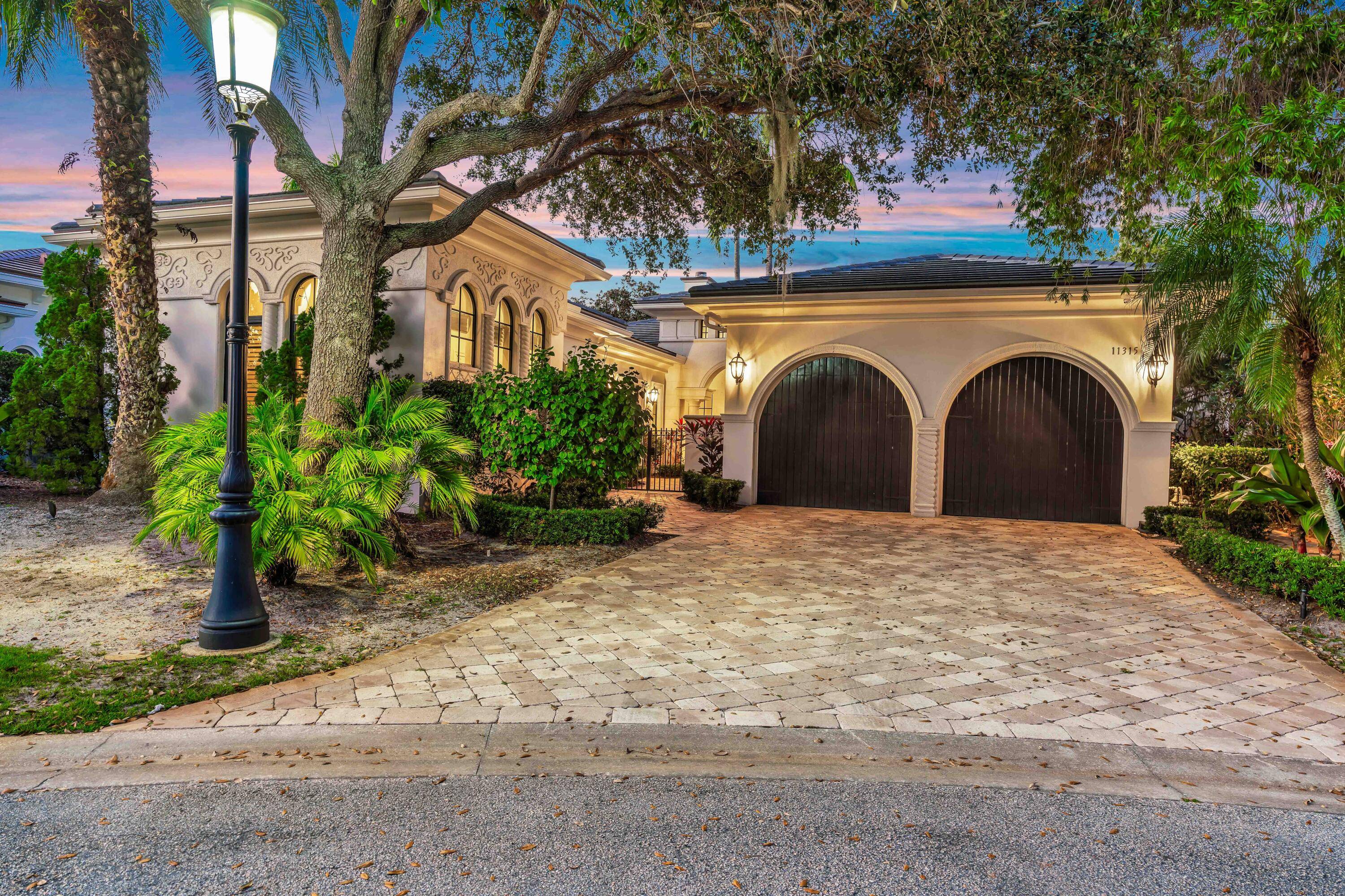 Welcome to this stunning residence in the prestigious Old Palm Golf Club.
