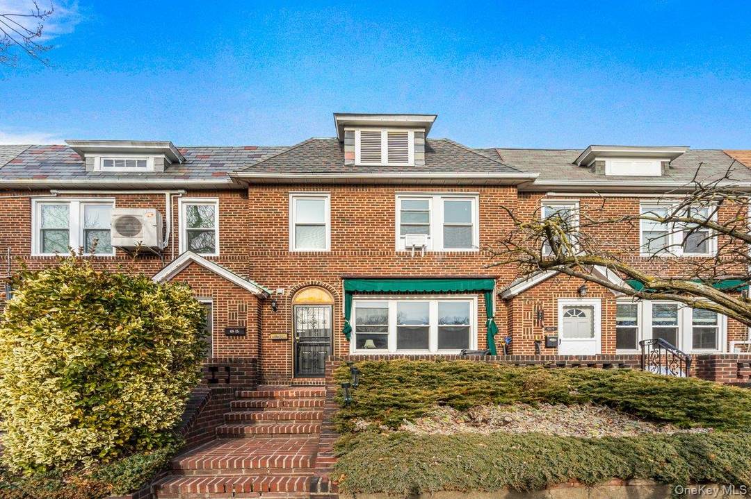 Updated and elegant single family attached brick townhouse on a beautiful, tree lined block of Groton Street.