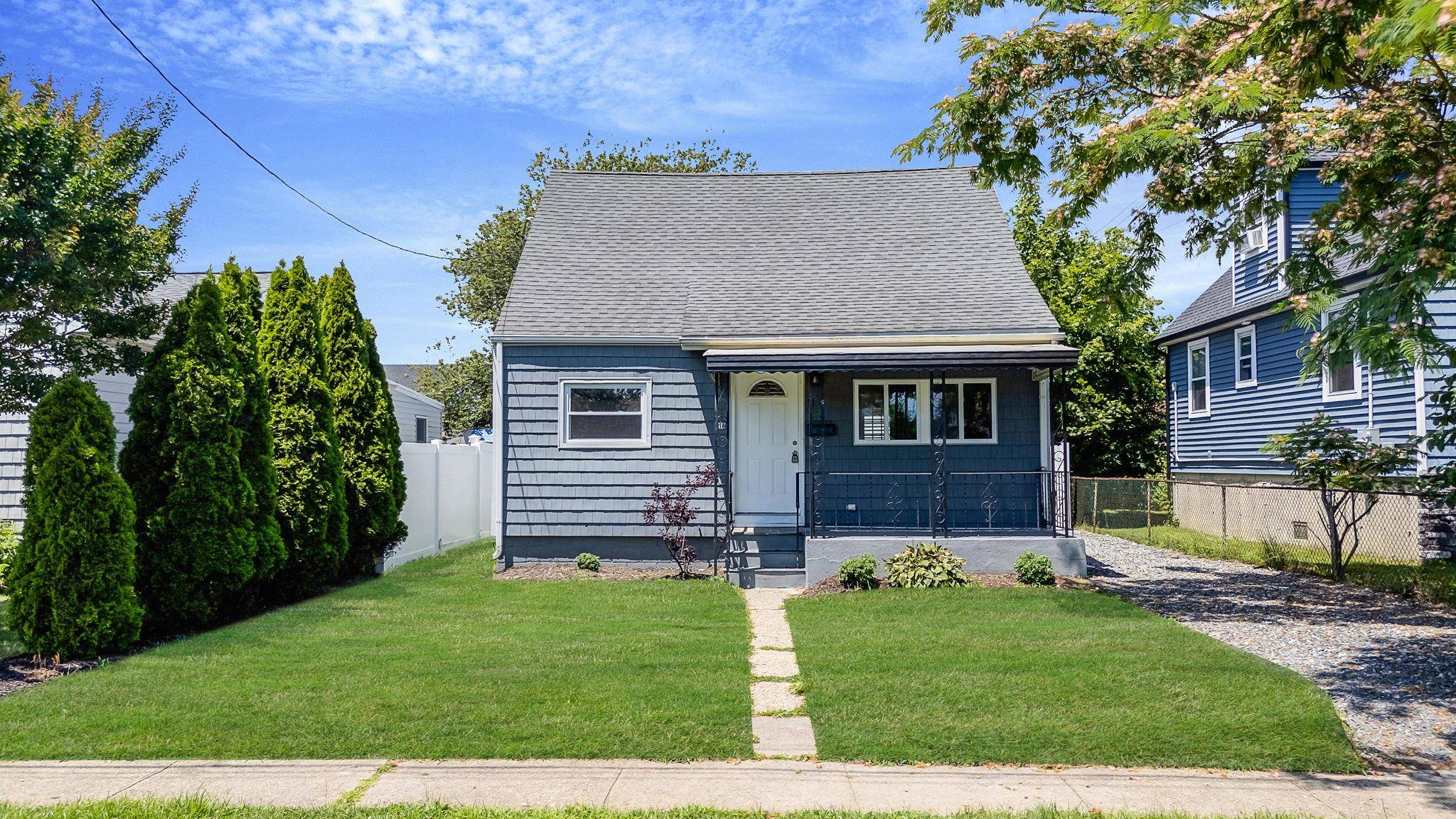 Welcome to this beautifully renovated Cape style home offering the perfect blend of classic charm and modern updates.