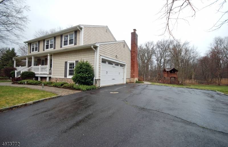 This 4 bedroom, 2 story, colonial styled home is located within a lovely residential collection moments from rail service to Manhattan.