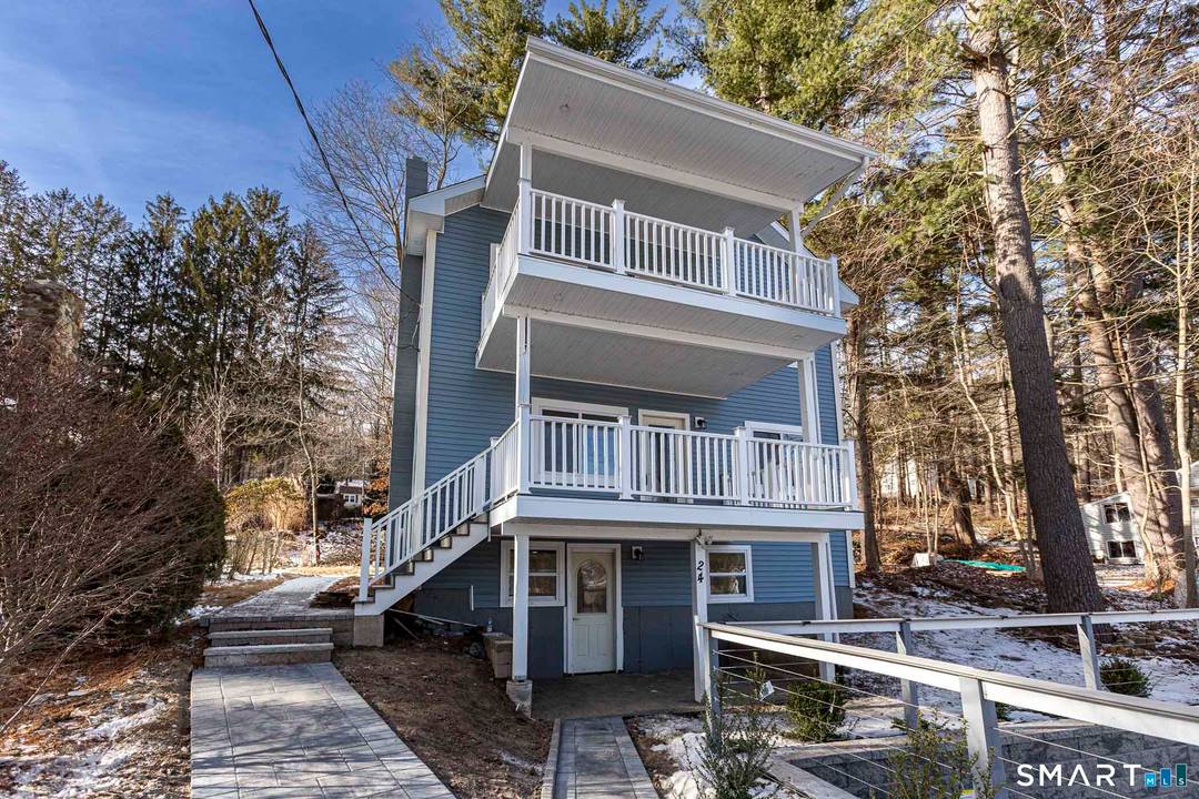 Lake Living at Its Finest Staffordville Reservoir Experience the perfect blend of luxury, lifestyle, and location in this stunning Colonial overlooking the Staffordville Reservoir, complete with lake beach rights approx.