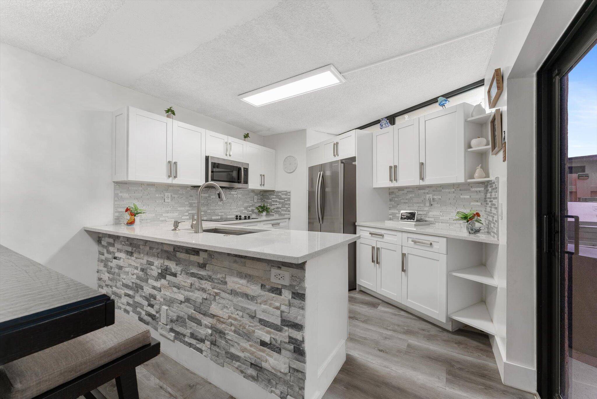 Beautiful and fully renovated townhouse featuring two spacious master bedrooms, each with its own private bathroom, plus a guest half bathroom on the first floor.