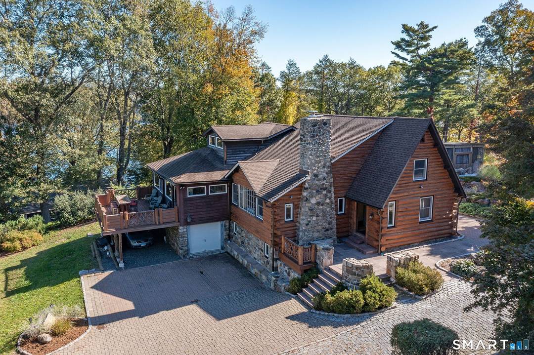 Come experience Candlewood Isle living and everything the community has to offer in a vintage cedar log home at the end of a cul de sac overlooking Candlewood lake.