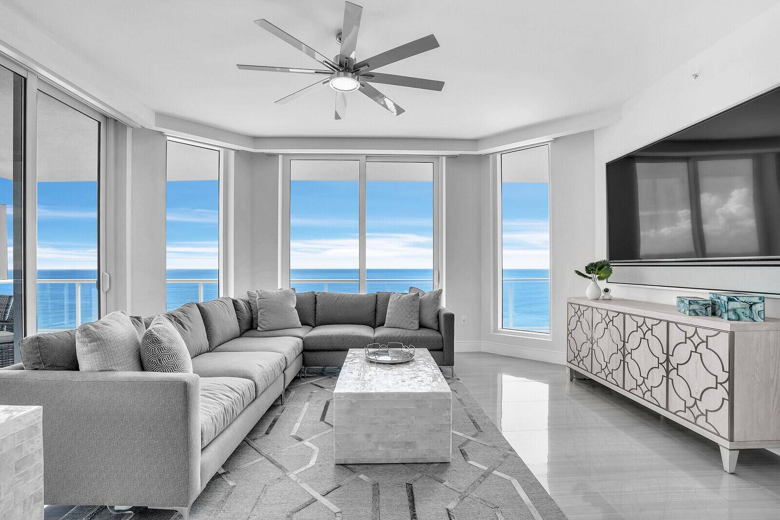 This stunning residence offers the perfect blend of modern design and coastal elegance.