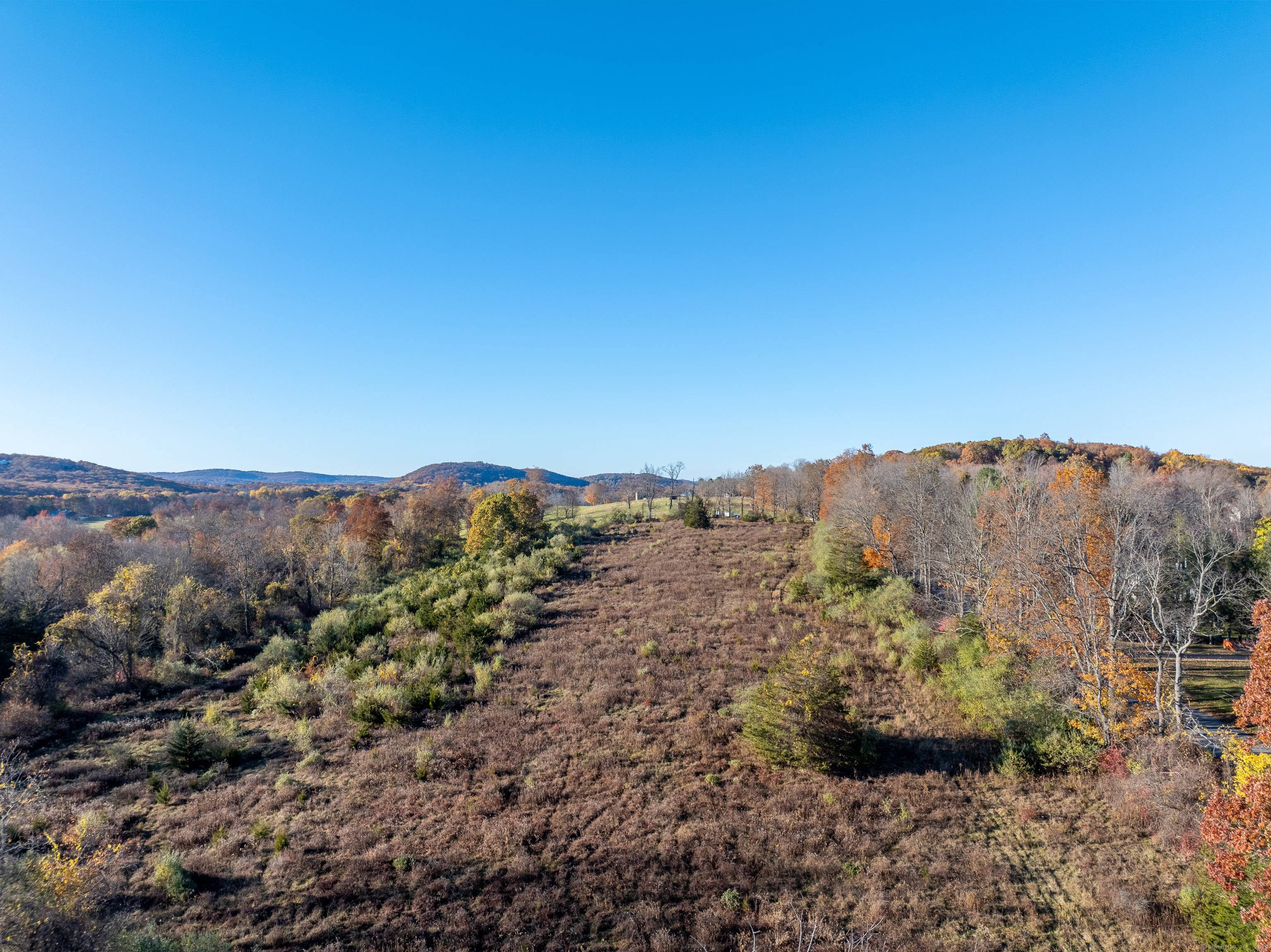 Discover an unparalleled opportunity on an elevated unspoiled lot on Candlewood Mountain Rd, New Milford, CT, where sophistication meets tranquility.