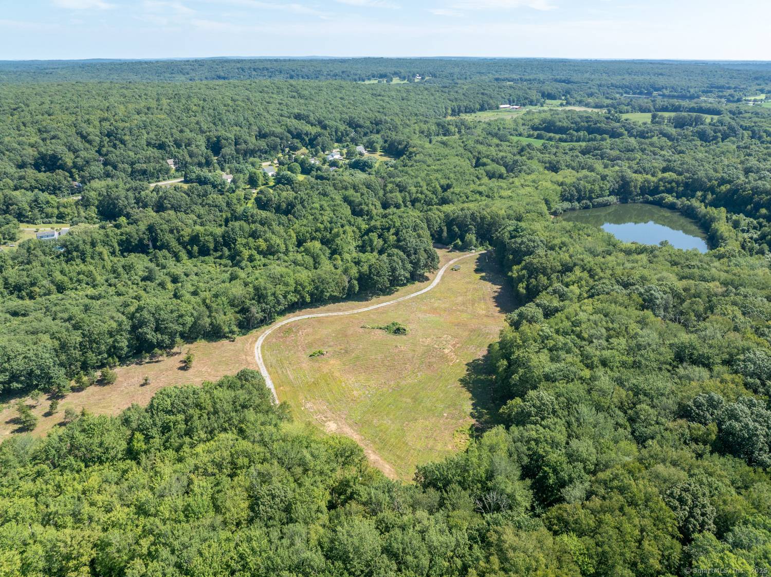 Welcome to 40 Caverly Mill Road, where nearly 86 acres of unspoiled natural beauty await.