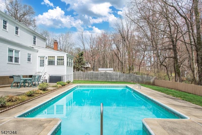 Welcome to this spacious Center Hall Colonial, ideally situated on a quiet cul de sac and featuring a private, fenced backyard with a fantastic in ground pool !