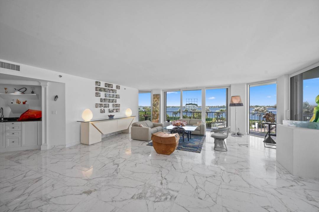 Highly desirable, light filled NW corner residence featuring an open concept layout with floor to ceiling impact windows and sliding glass doors that showcase sweeping ocean and Intracoastal views.