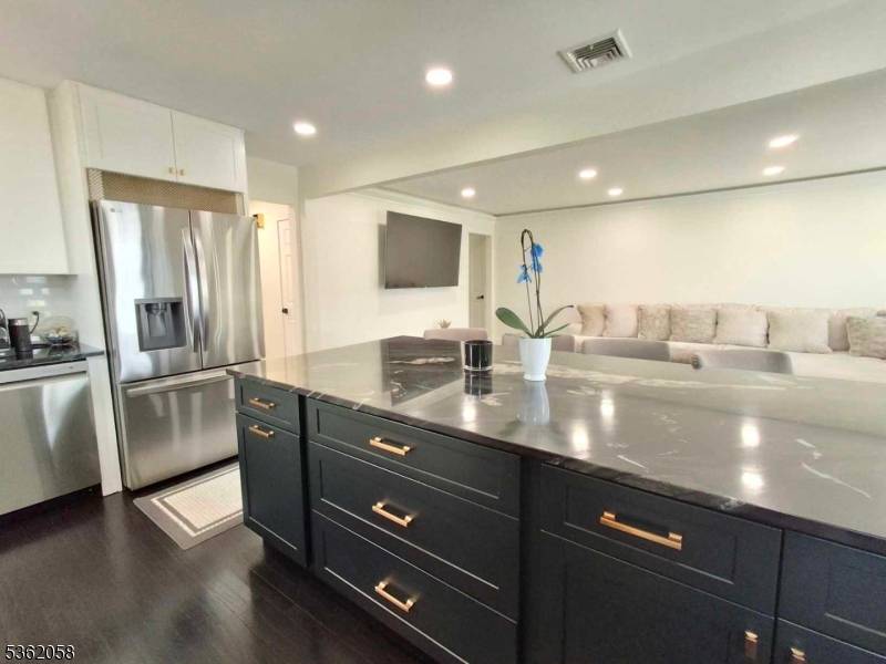 This beautifully renovated custom ranch is ideally situated on private end street location.