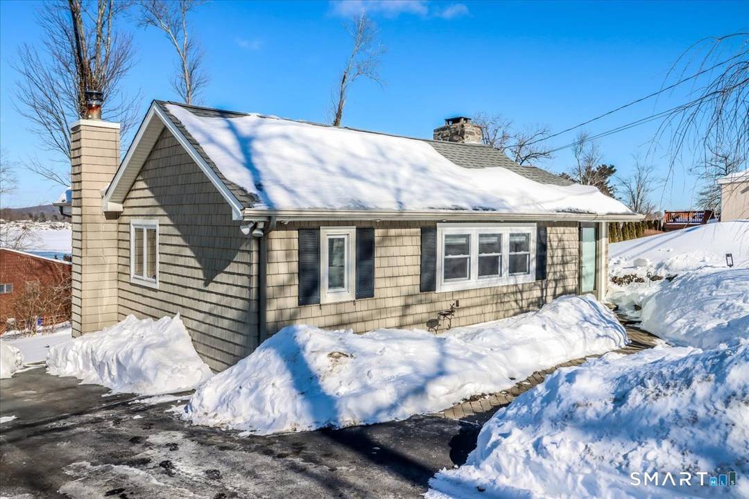 Located in the sought after Pocono Point community and just steps from Candlewood Lake, 108 Forty Acre Mountain Road offers the perfect blend of relaxed lake living and peaceful privacy.