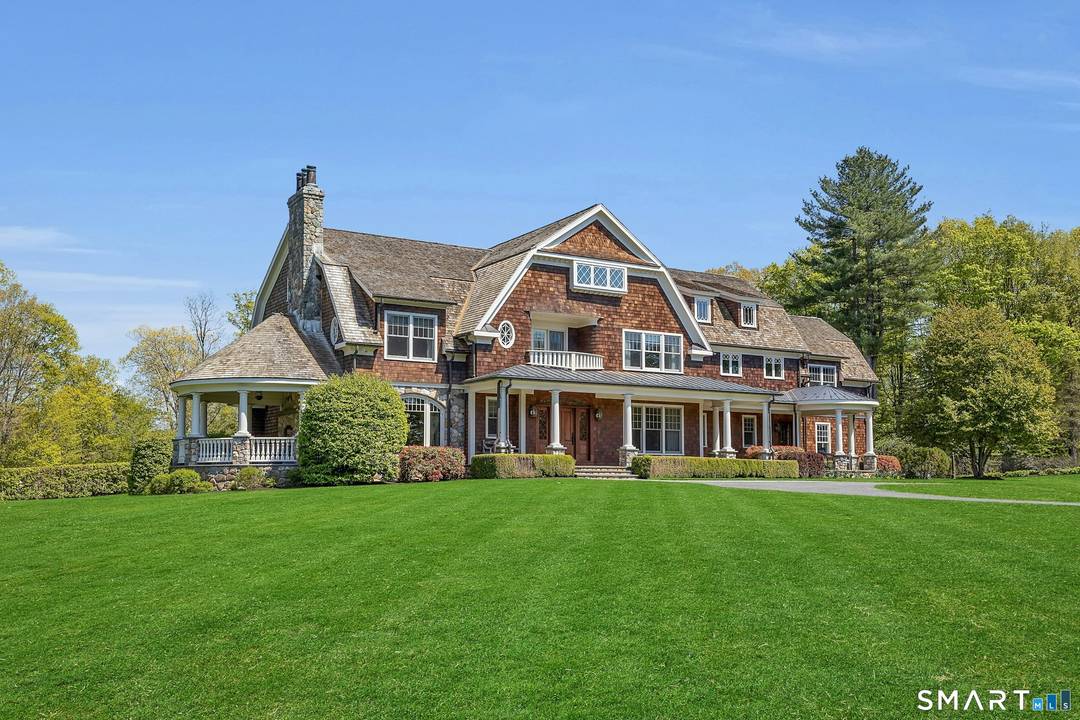 Exquisite Nantucket style country estate magnificently sited on seven sprawling acres in Redding, CT's coveted Umpawaug neighborhood.