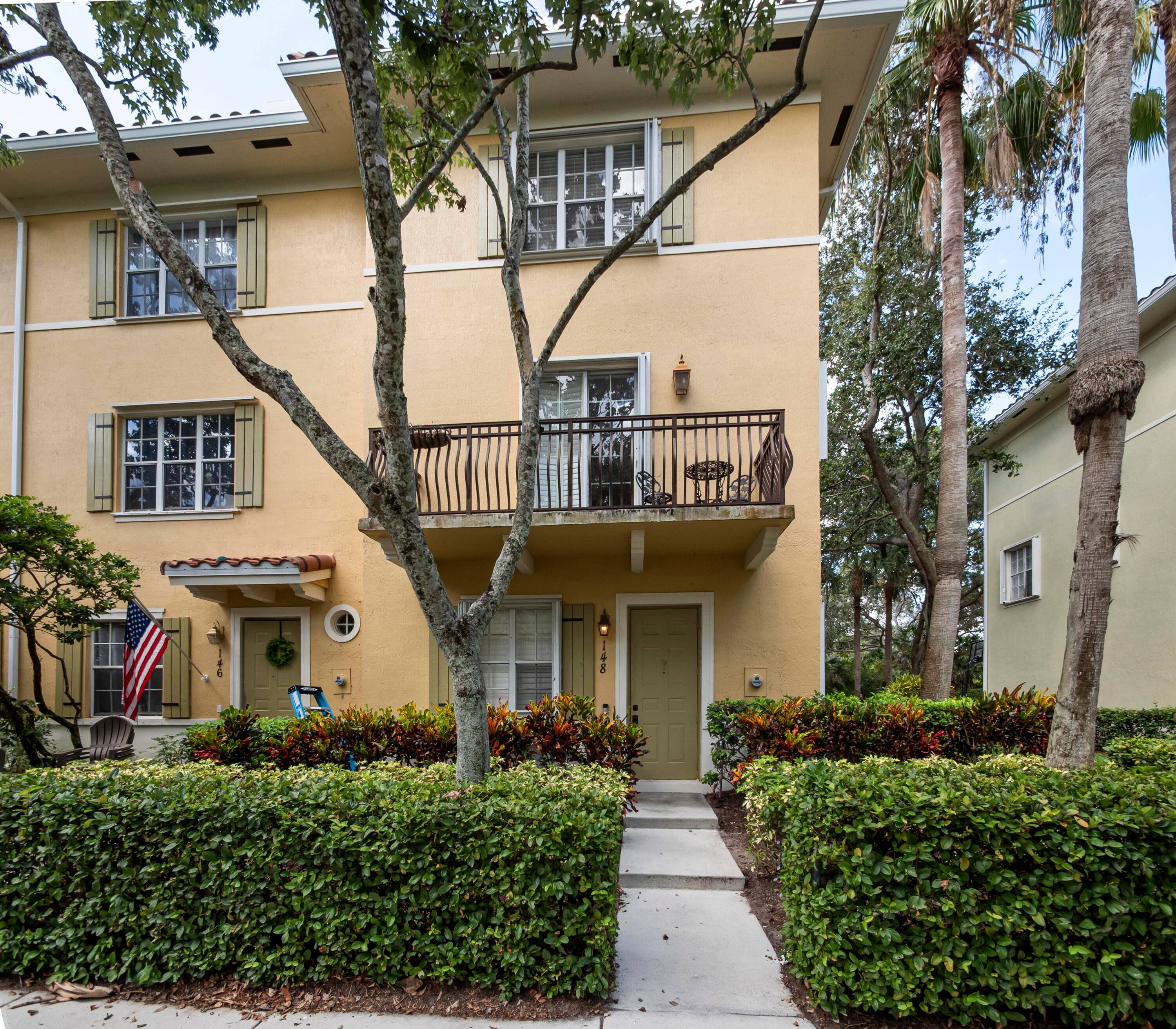 Beautiful end unit townhome in Osceola Woods at Abacoa featuring 3 bedrooms, 2 full and 2 half baths, 1, 998 sq ft, and a 2 car garage.