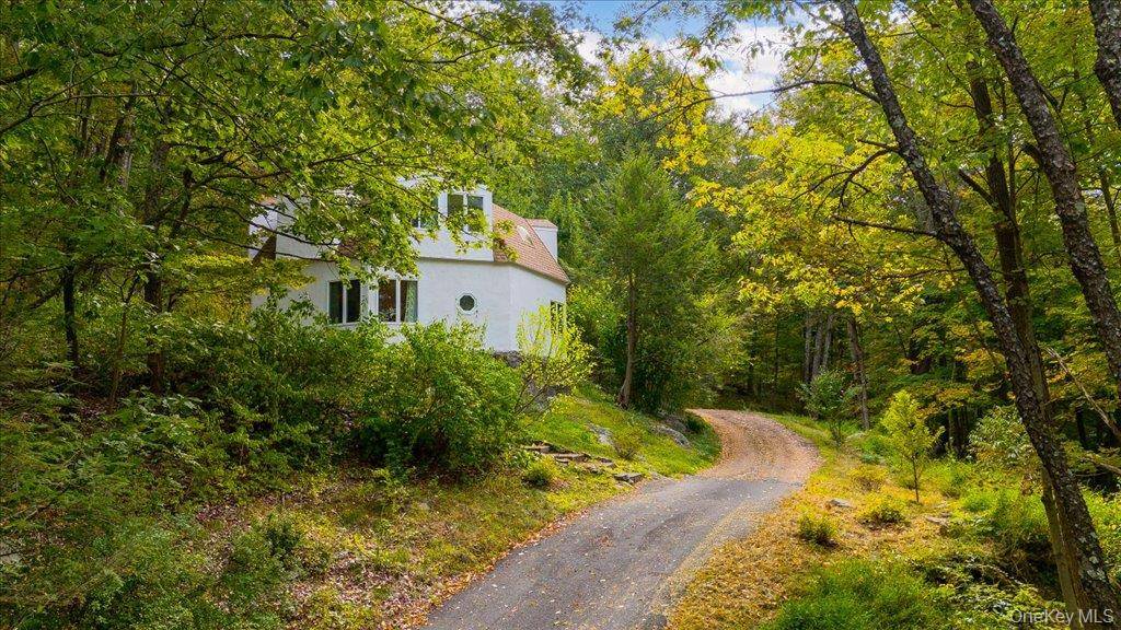 Inside a private wooded haven, this one of a kind, pristine home will make you feel like you're on a never ending vacation !