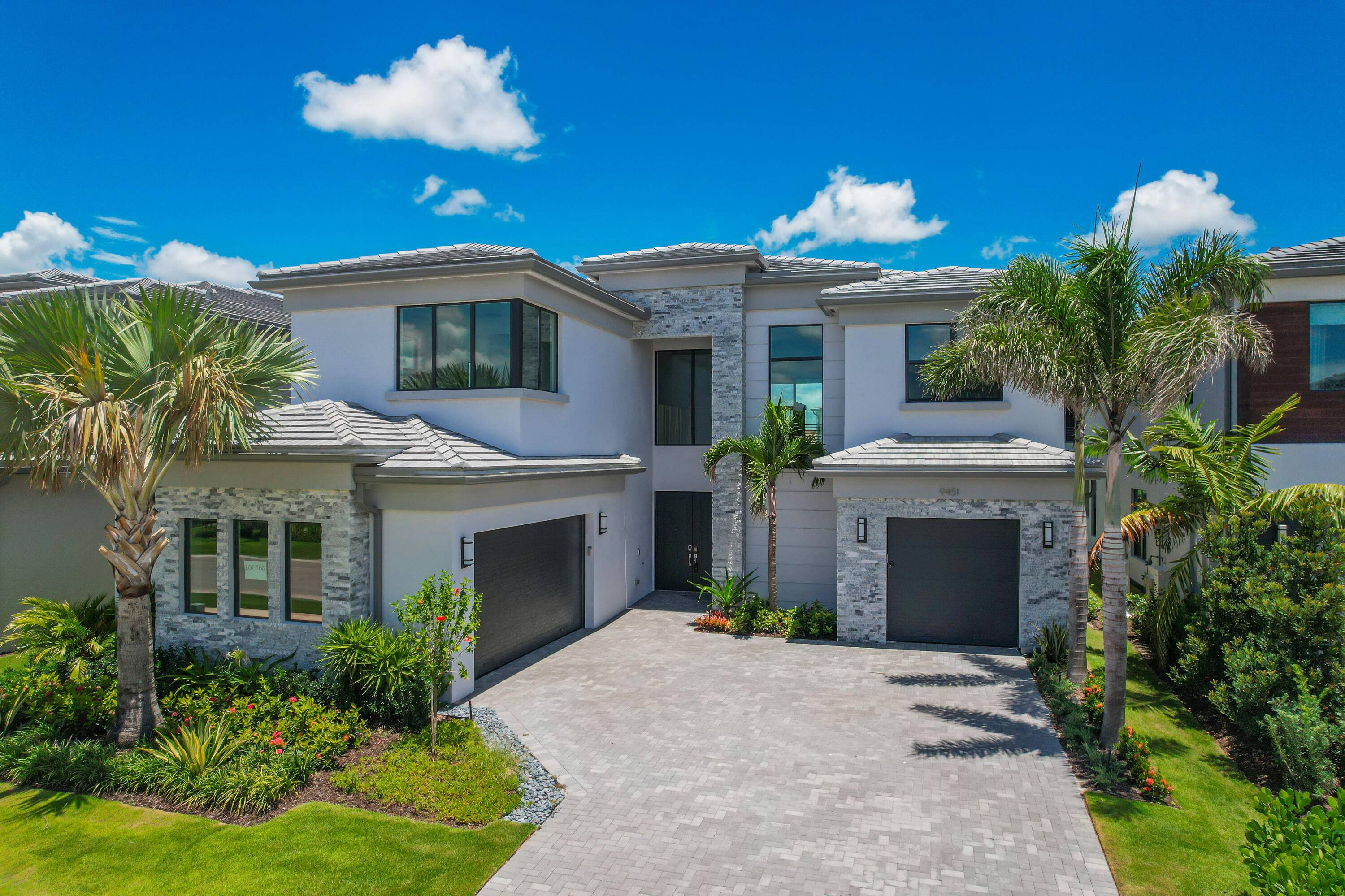 This brand new, luxurious single family home in the sought after Lotus Edge community offers the perfect blend of sophistication, comfort, and modern living.