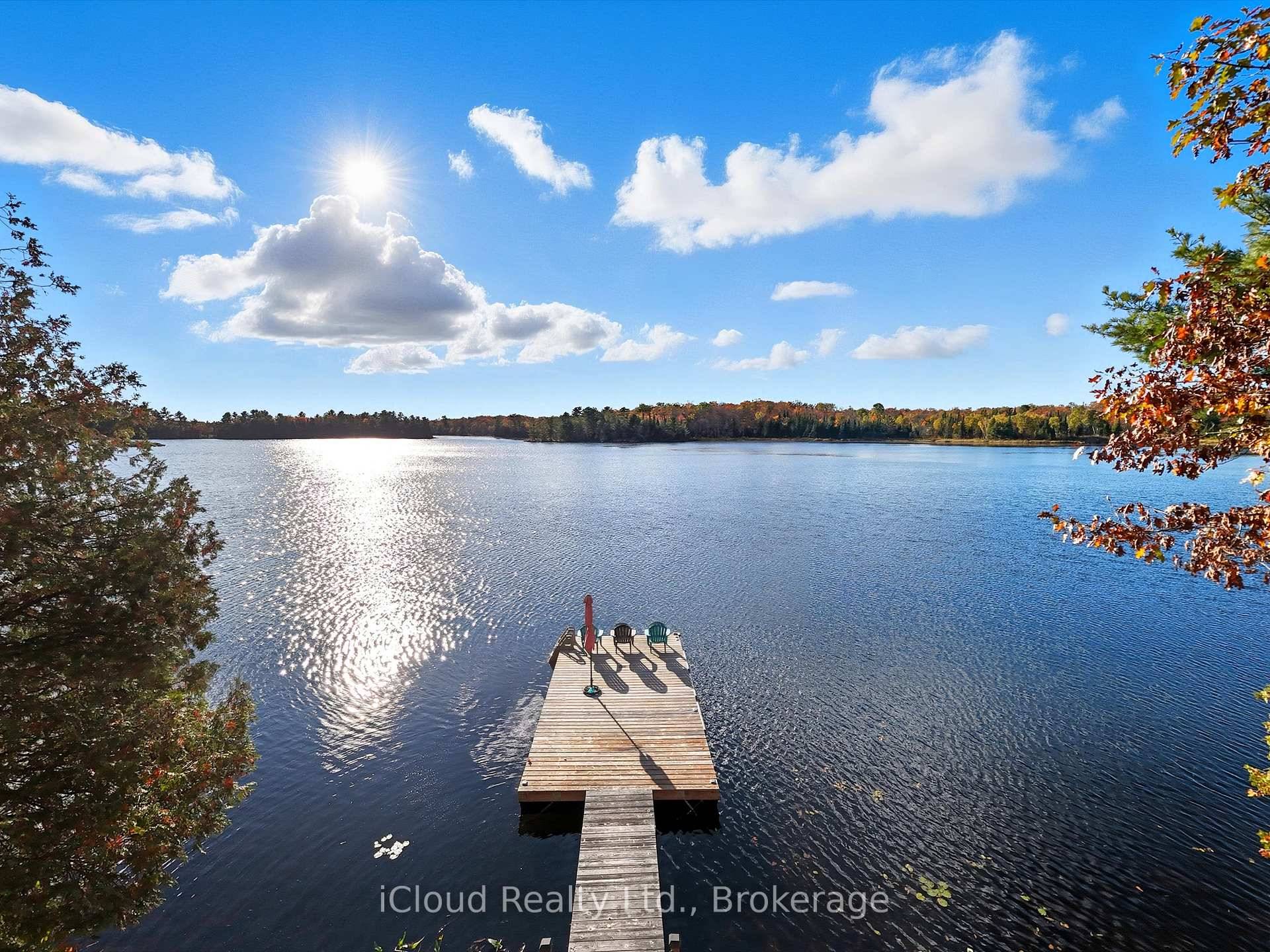 Escape to the tranquility of waterfront living with this charming rustic cottage on Limestone Lake.