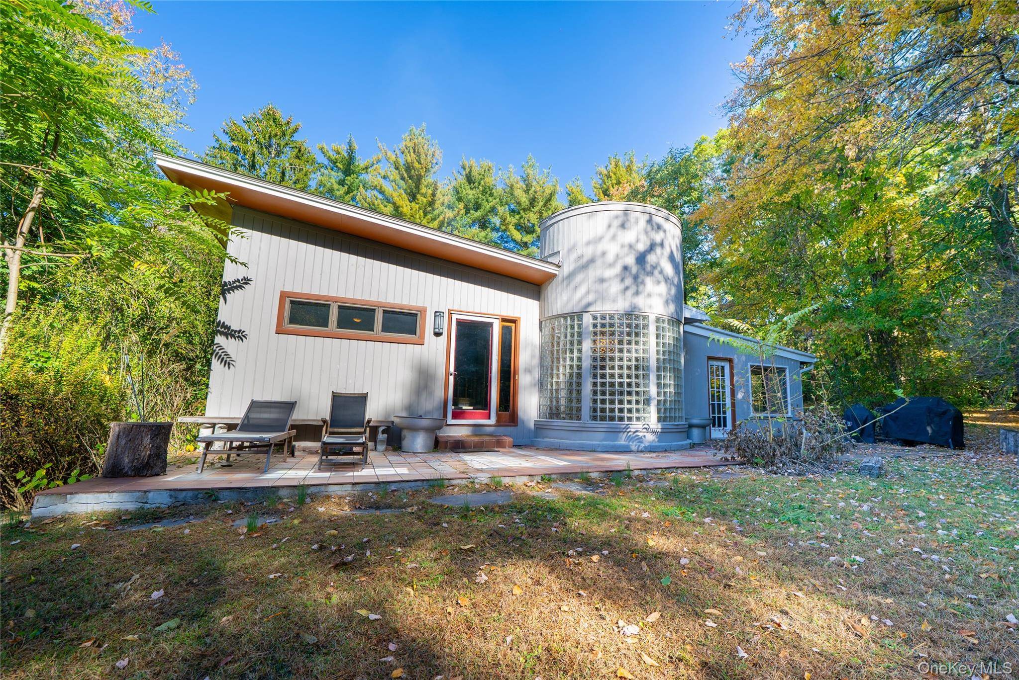 This one of a kind mid century modern home blends sleek design with natural beauty.