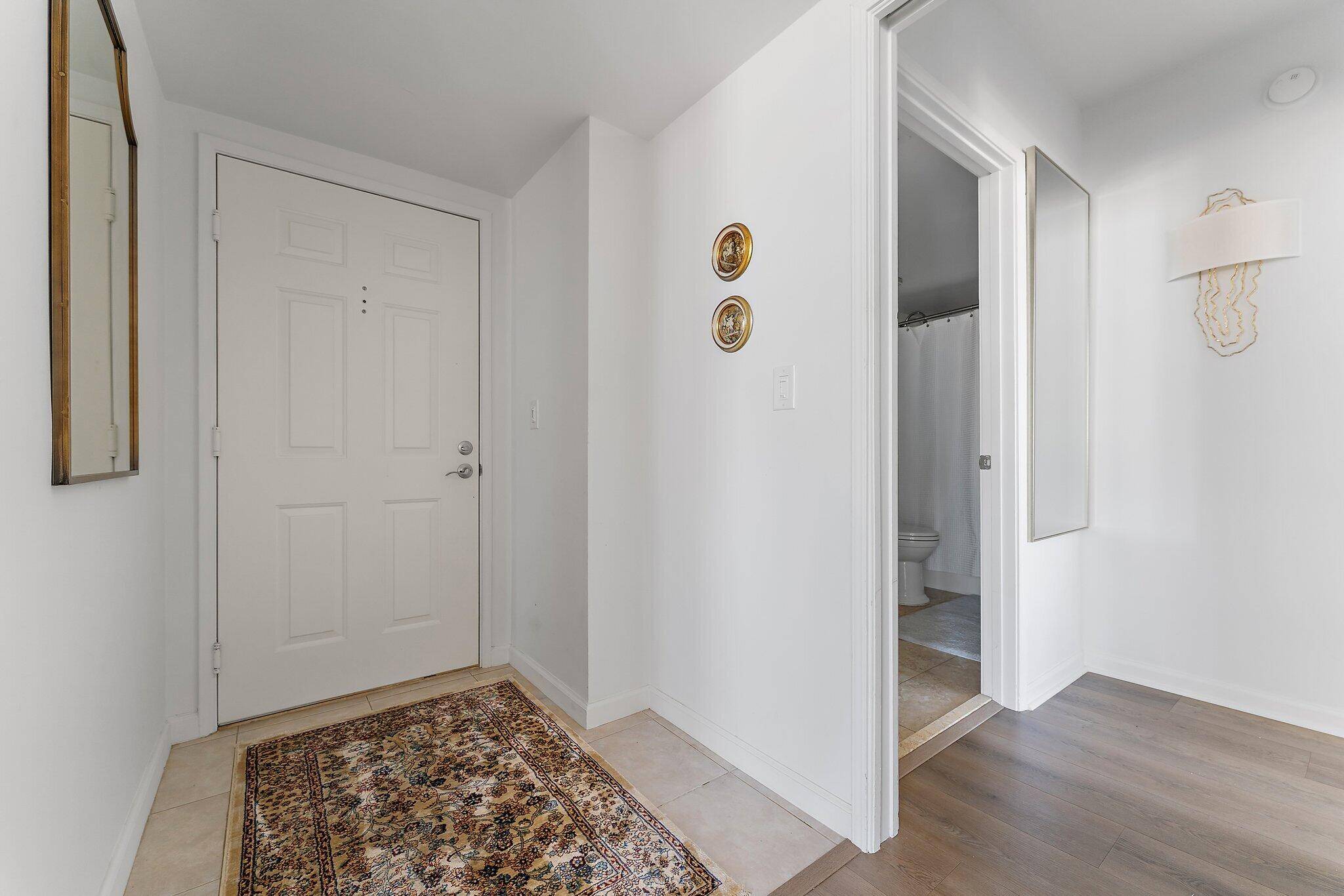 In the heart of city place and minutes to Palm Beach Island, this corner apartment boasts abundant natural light from the extra windows, creating a serene and quiet haven.