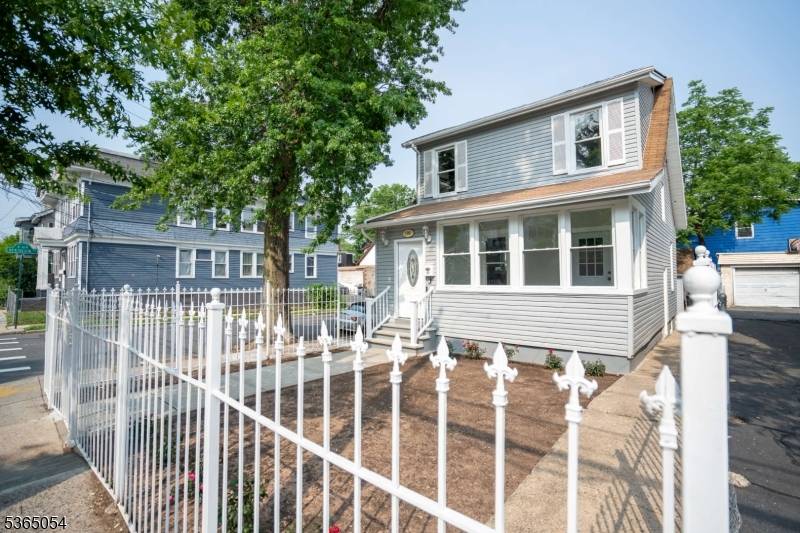 Charming 3 Bedroom Home with Detached Garage, Enclosed Porch More !