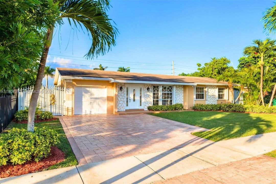 Enjoy the ultimate South Florida lifestyle in this stunning screened in pool home set on a lush, oversized 9, 000 sq ft fully fenced lot with mature fruit trees.