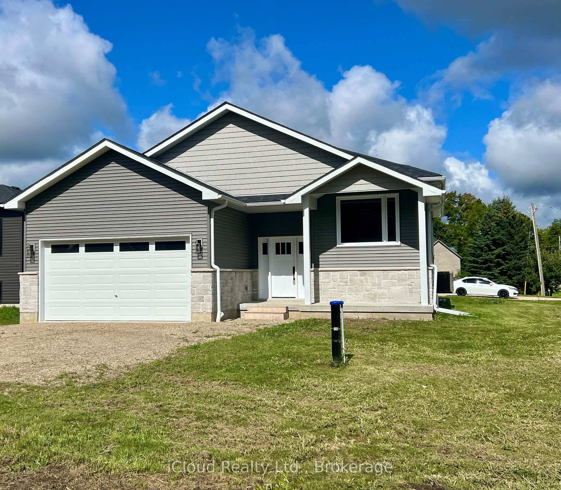 Beautifully Built Bright New Raised Bungalow on a quiet rural 66' x 132' lot in Proton Station.