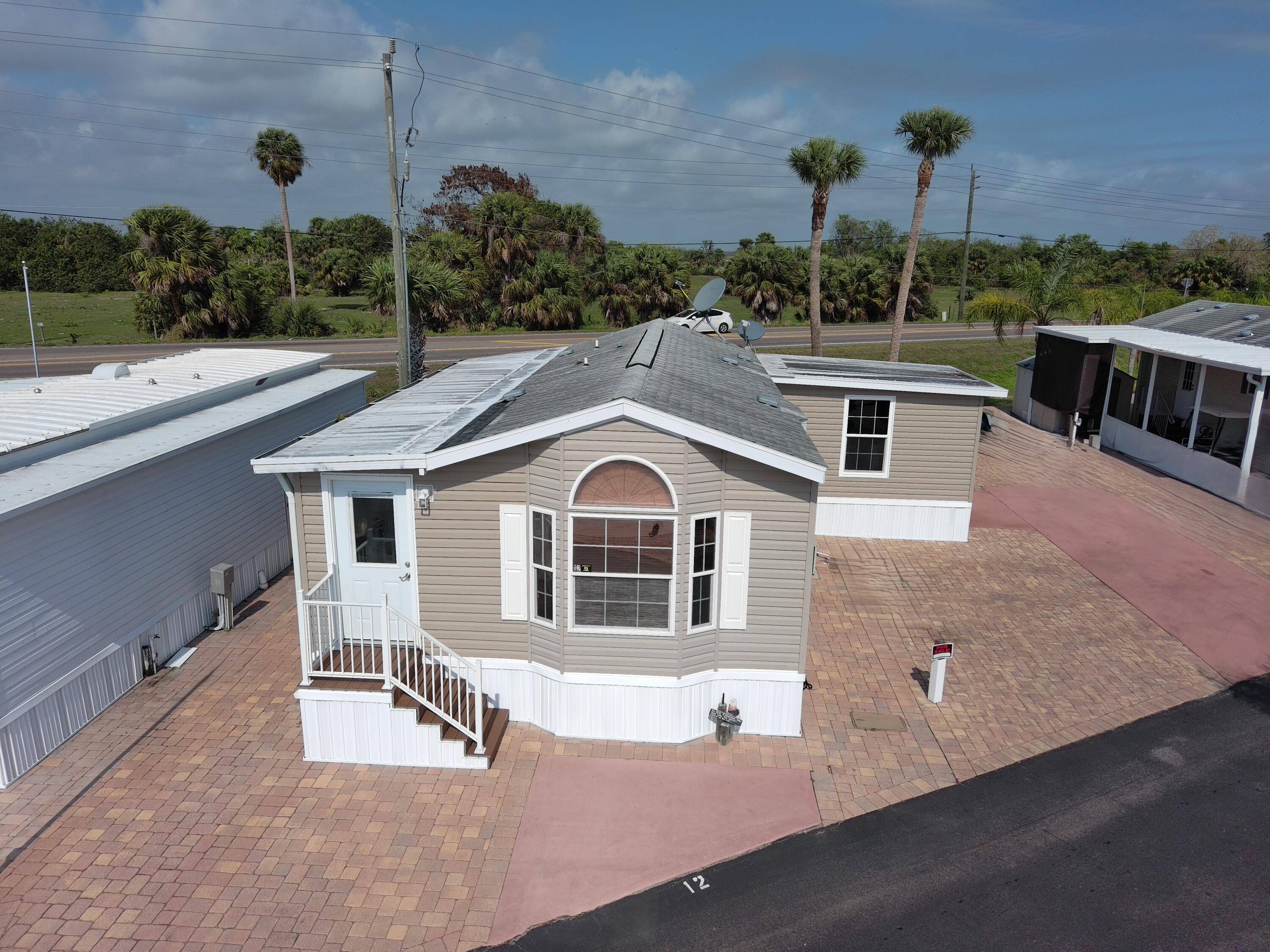 Wowza ! Big O RV Park furnished home on DOUBLE lot with RV hookup.