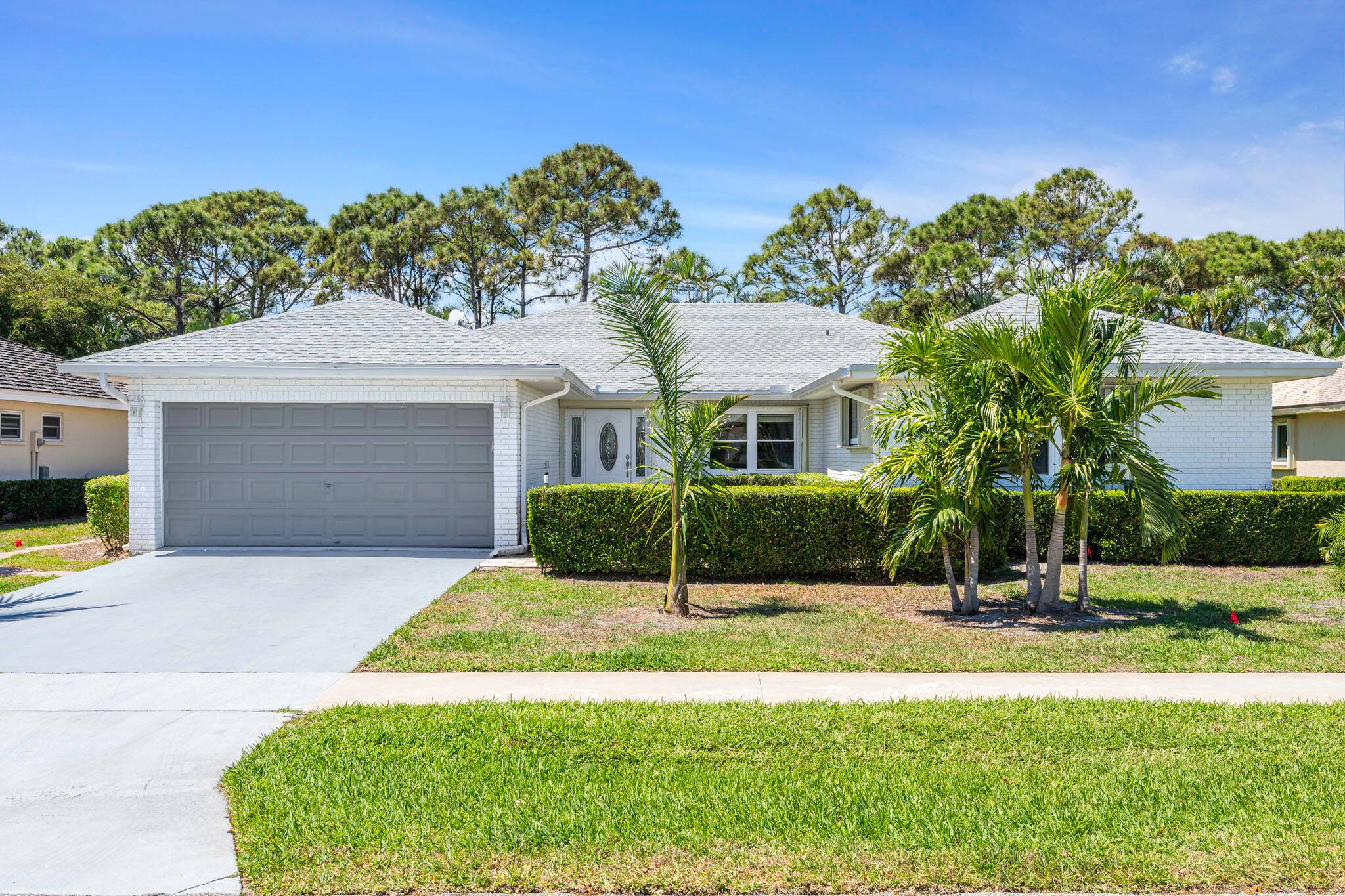 Spacious 3 bedroom, 2 bathroom home with a 2 car garage located in Pine Tree Village, a 55 community in Boynton Beach.