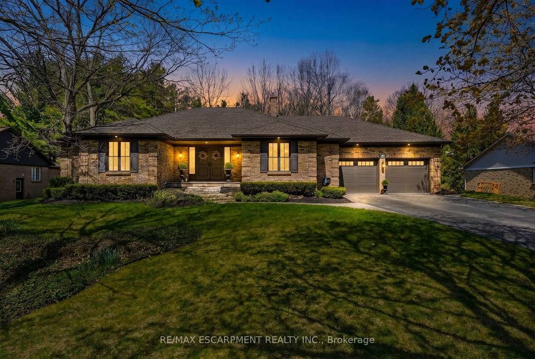 Nestled in the heart of beautiful Carlisle, this exceptional detached bungalow sits on an expansive nearly half acre lot 100 x 200 ft, offering the perfect blend of privacy, space, ...