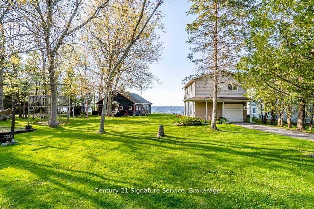 Experience the ultimate waterfront lifestyle on Georgian Bay with this exceptional 122' property featuring two unique cottages.