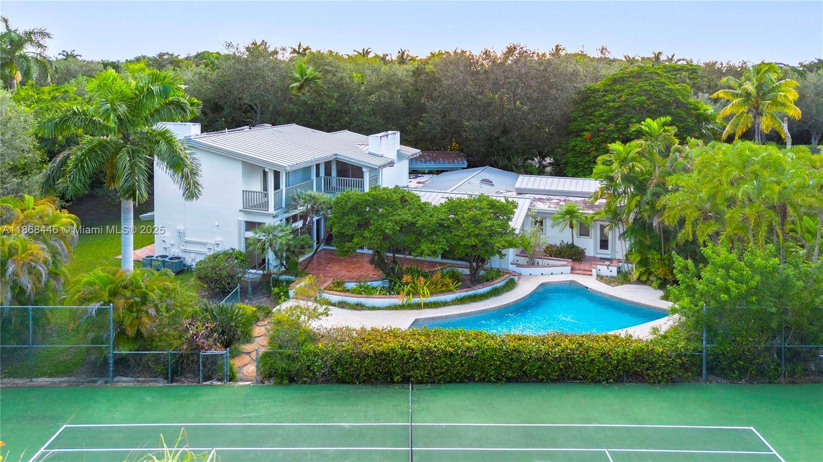 Spacious Mid Century Pinecrest Estate with HIGH CEILINGS on a 39, 204 SF Lot with a Tennis Court in desirable SE Pinecrest !