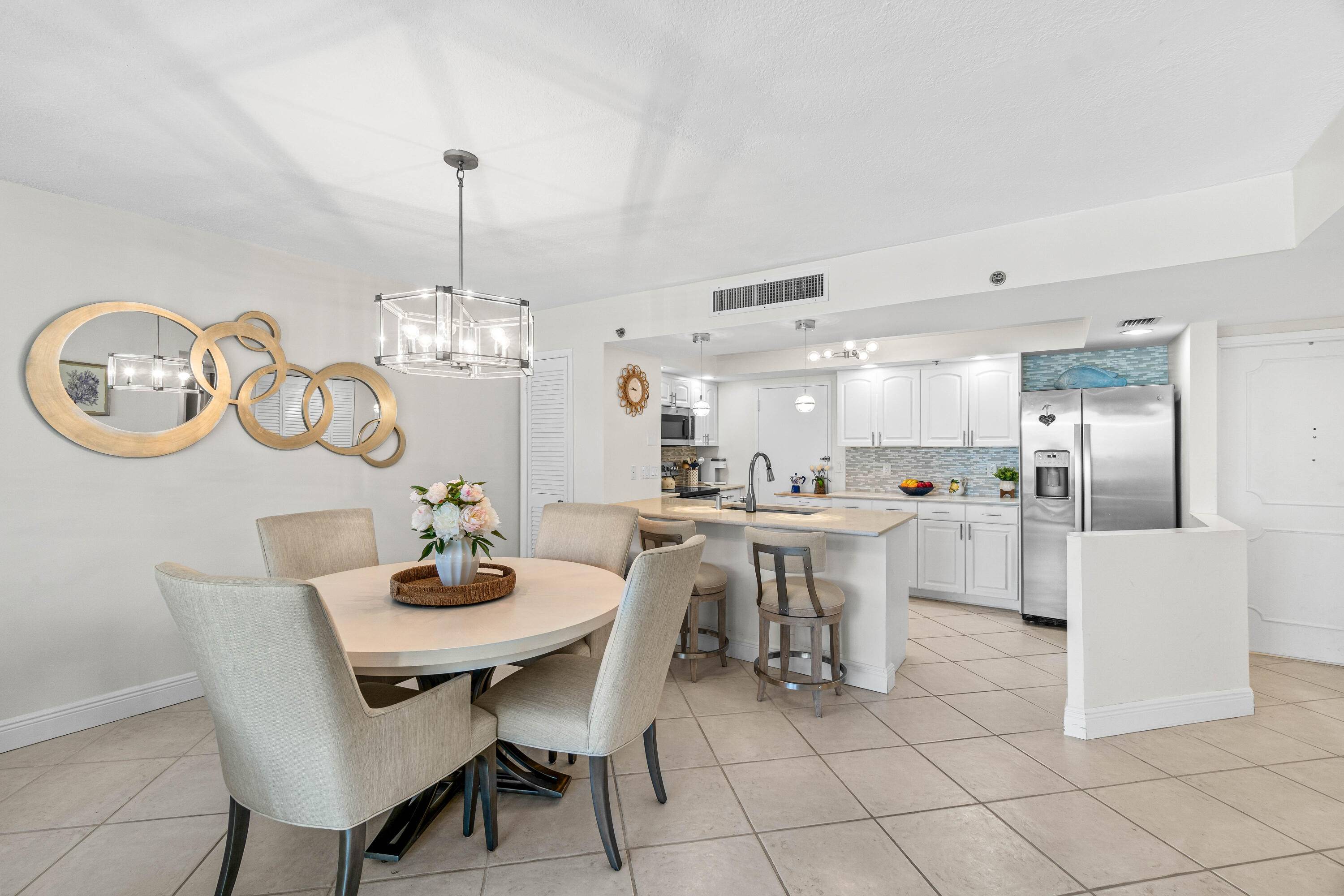 Enjoy stunning Marina and Intra coastal views from this beautifully appointed Condo in the highly sought after Boca Highland Beach Club Aberdeen Arms.