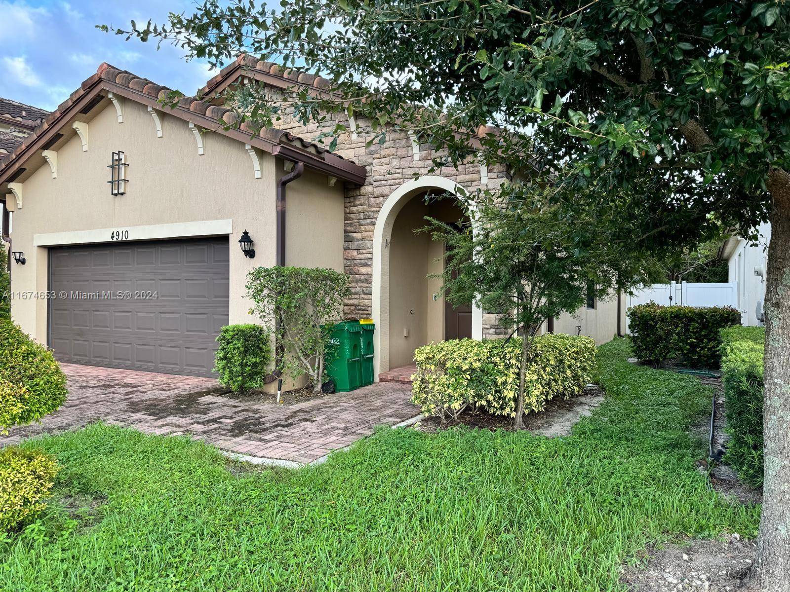 This modern home, built in 2017, is located in the highly sought after Manor Parc community in Tamarac It boasts a range of impressive features, Hurricane Impact Windows and Doors, ...