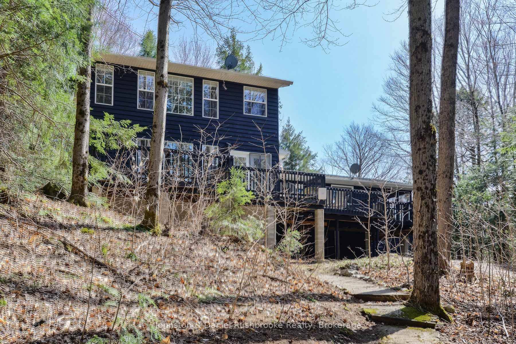 Welcome to Treetops, a cherished family cottage tucked into a peaceful pocket of Sucker Lake with 150 feet of gently sloping shoreline !