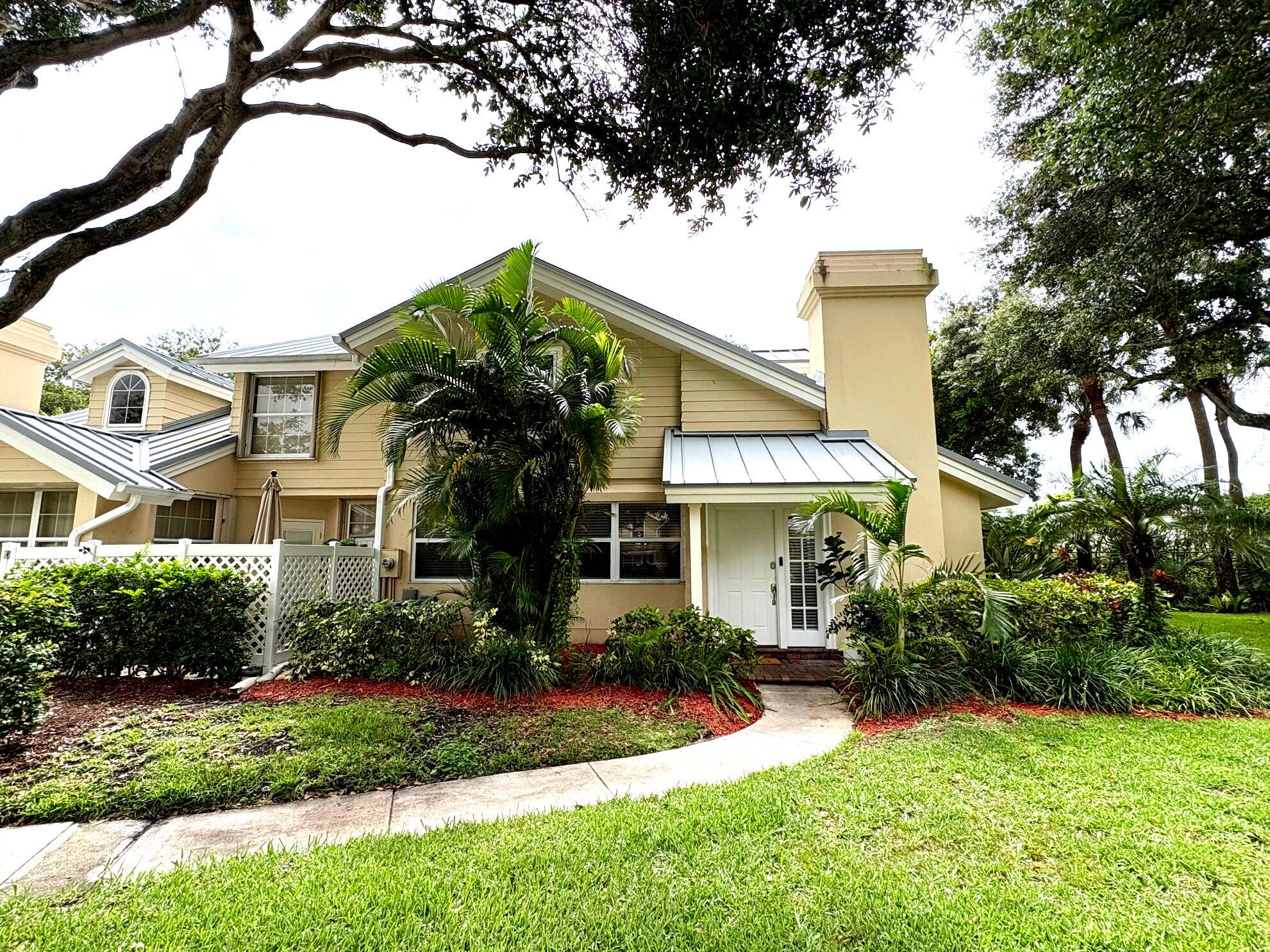Serenity abounds in this Renovated Townhouse in a 24 hour manned quiet gated community.