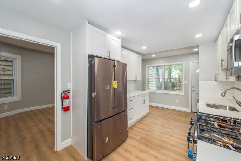 Beautifully updated 5 bedroom, 3 bath home featuring modern upgrades throughout, including new electrical, plumbing, flooring, and kitchen.