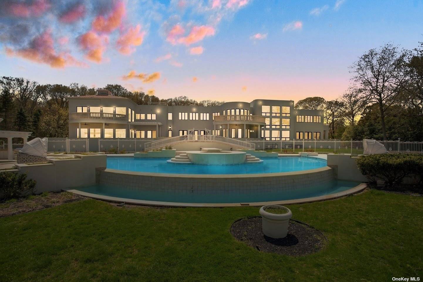 Introducing the epitome of Luxury Beachfront living an extraordinary Mega Mansion perched on a majestic clifftop, overlooking the breathtaking Long Island Sound.
