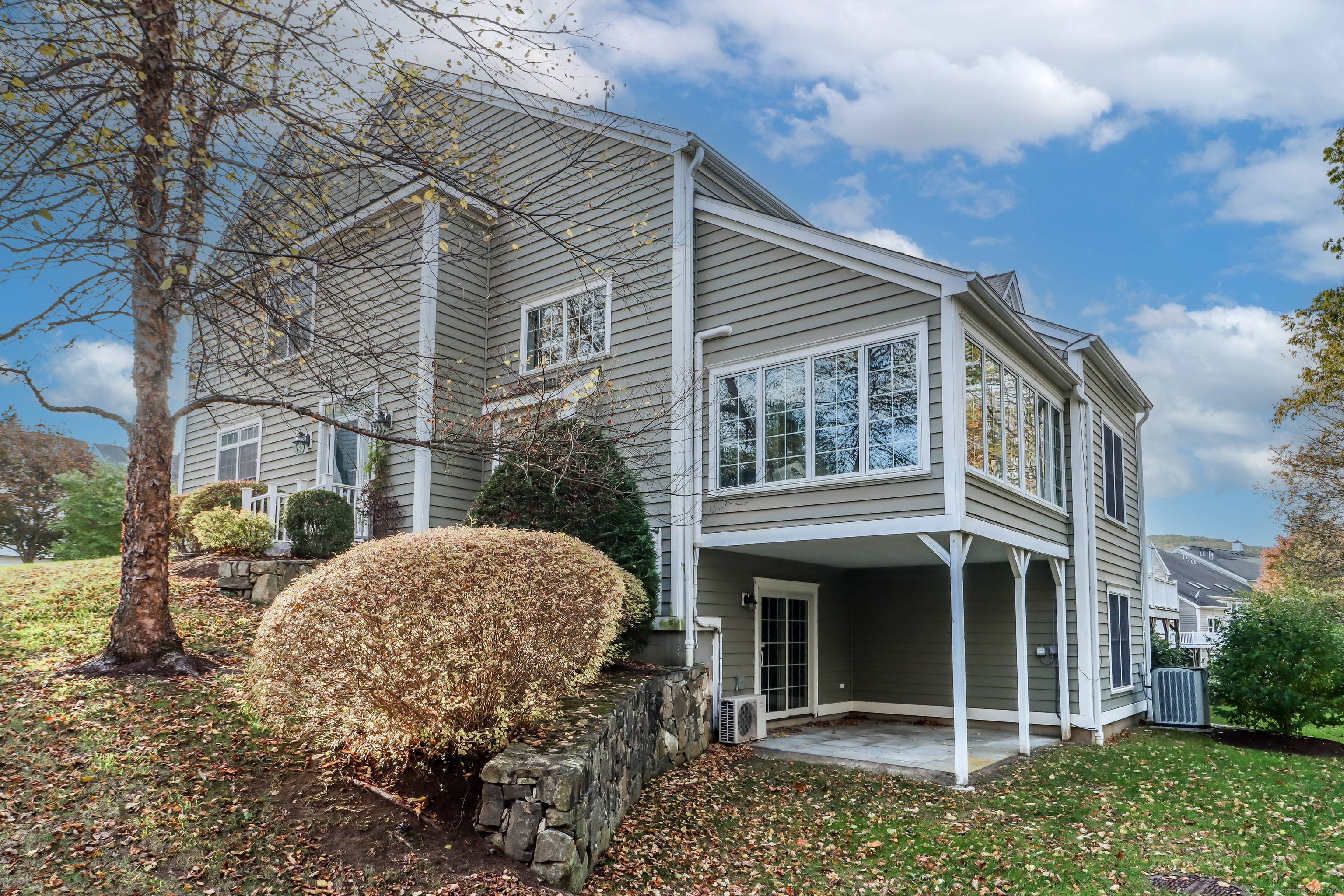 Experience the best of main level living in this beautifully refreshed townhome in sought after Newbury Village, Brookfield's premier 55 community.