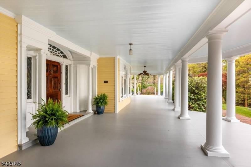 Perched atop a hill in the coveted South End with sweeping NYC views, this distinguished 1898 Colonial by noted architect Warrington G.