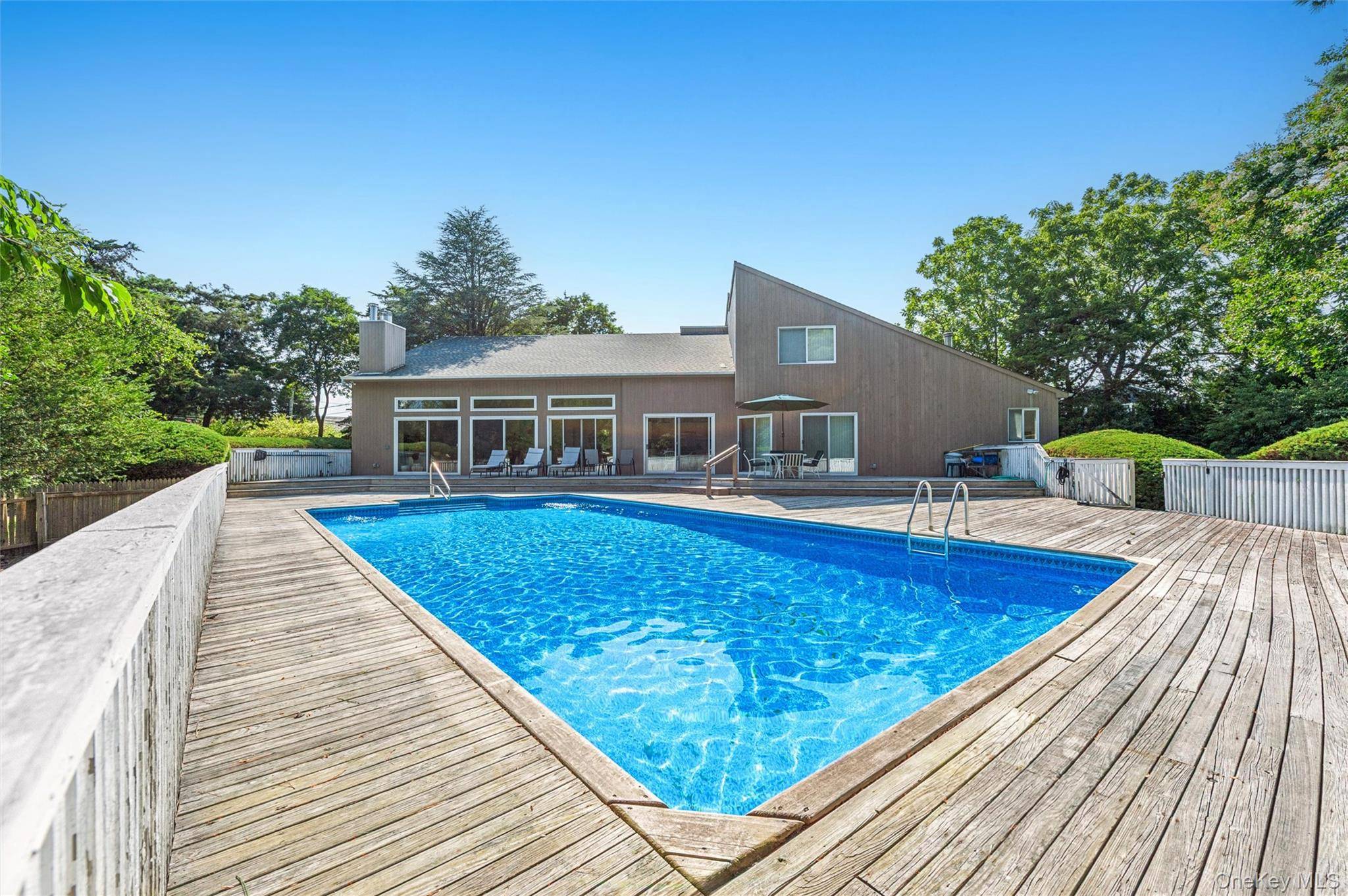 EAST QUOGUE OPPORTUNITY Set on a full acre, this 3 bedroom, 2.