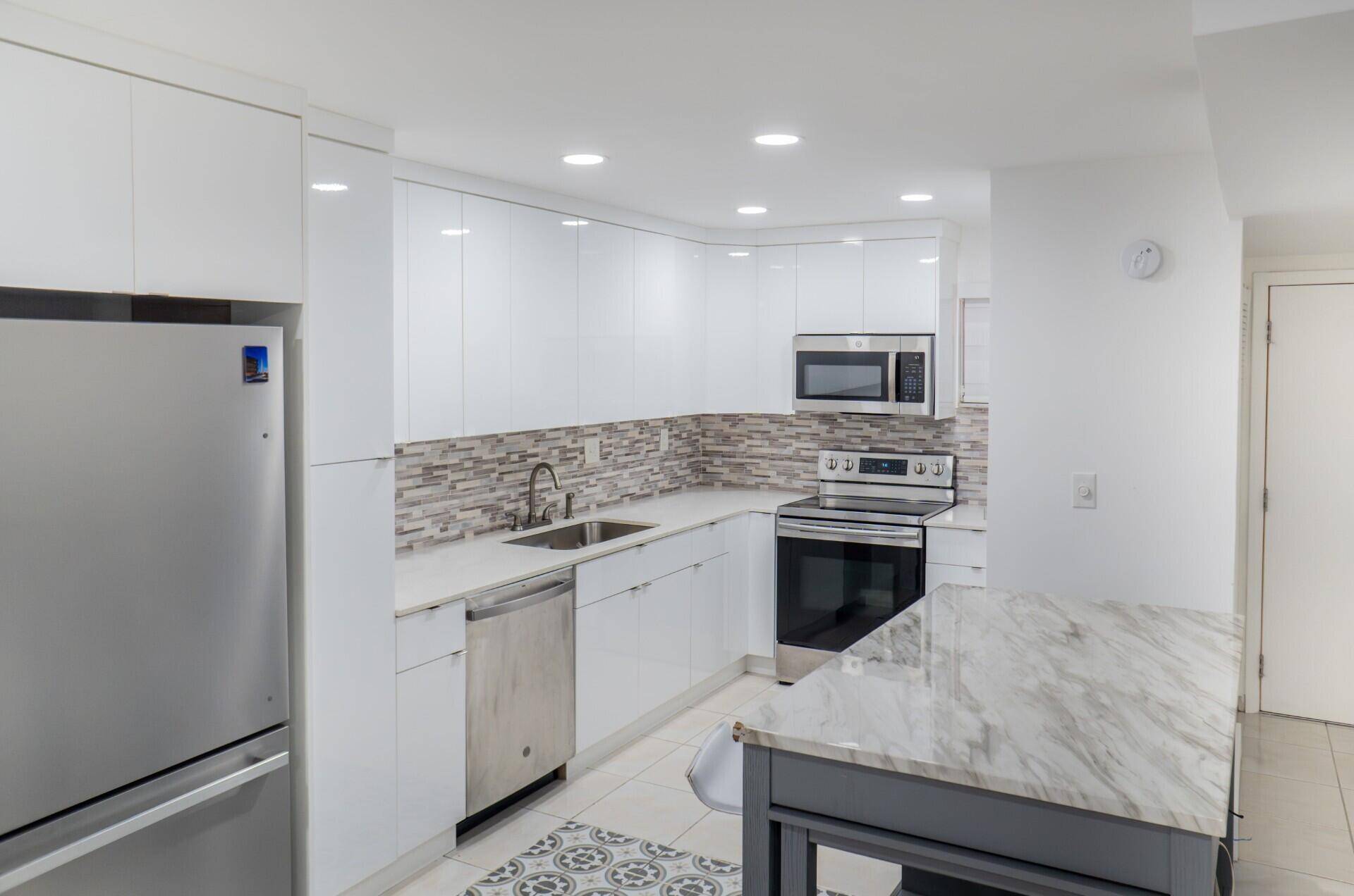 This gated condo community includes common area maintenance, grounds maintenance, building maintenance, roof repair and replacement, the community pool, and security.