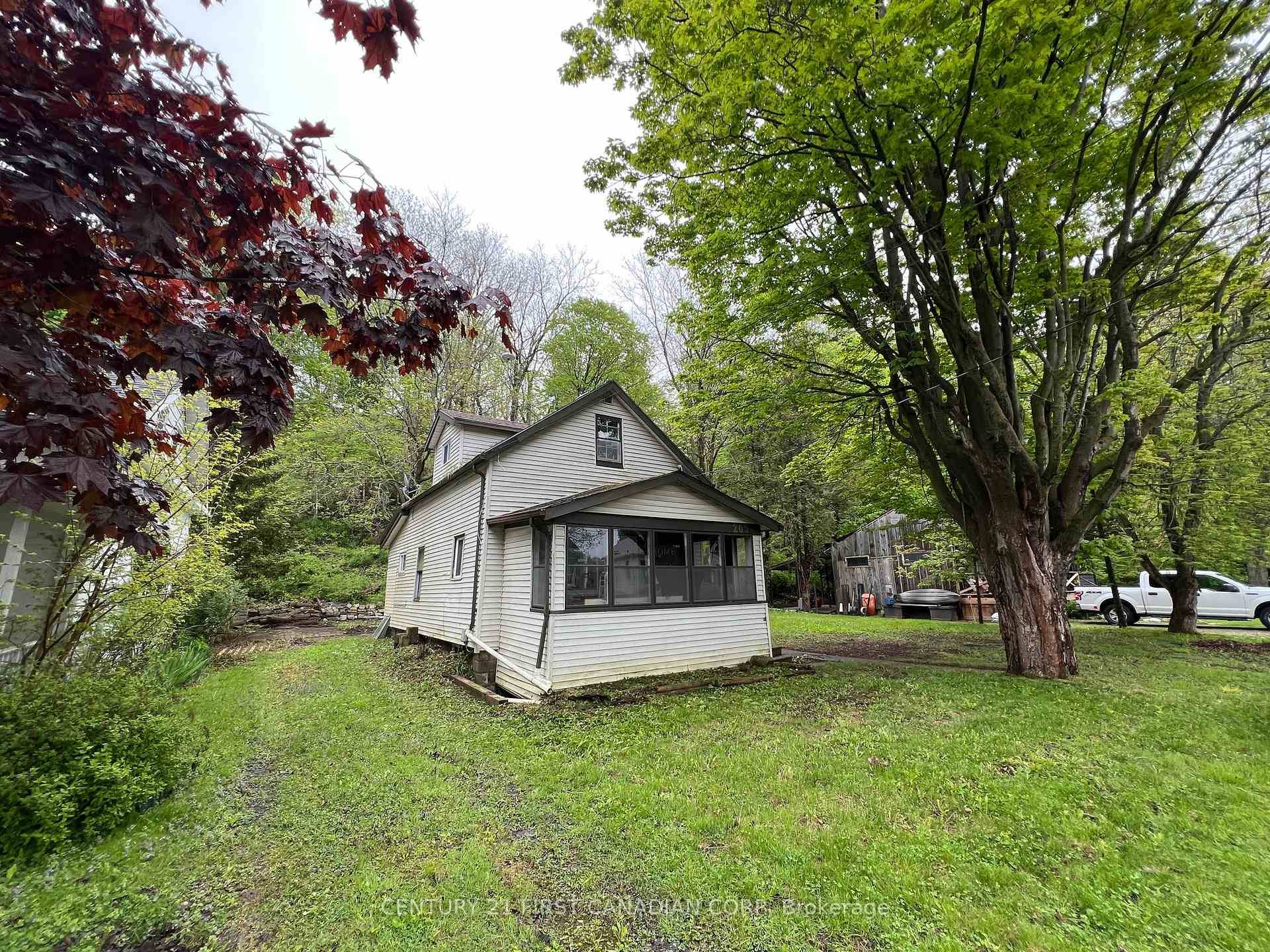 On a gorgeous quiet neighbourhood street sits a house on a large double lot a terrific development opportunity right here in the heart of Port Stanley !