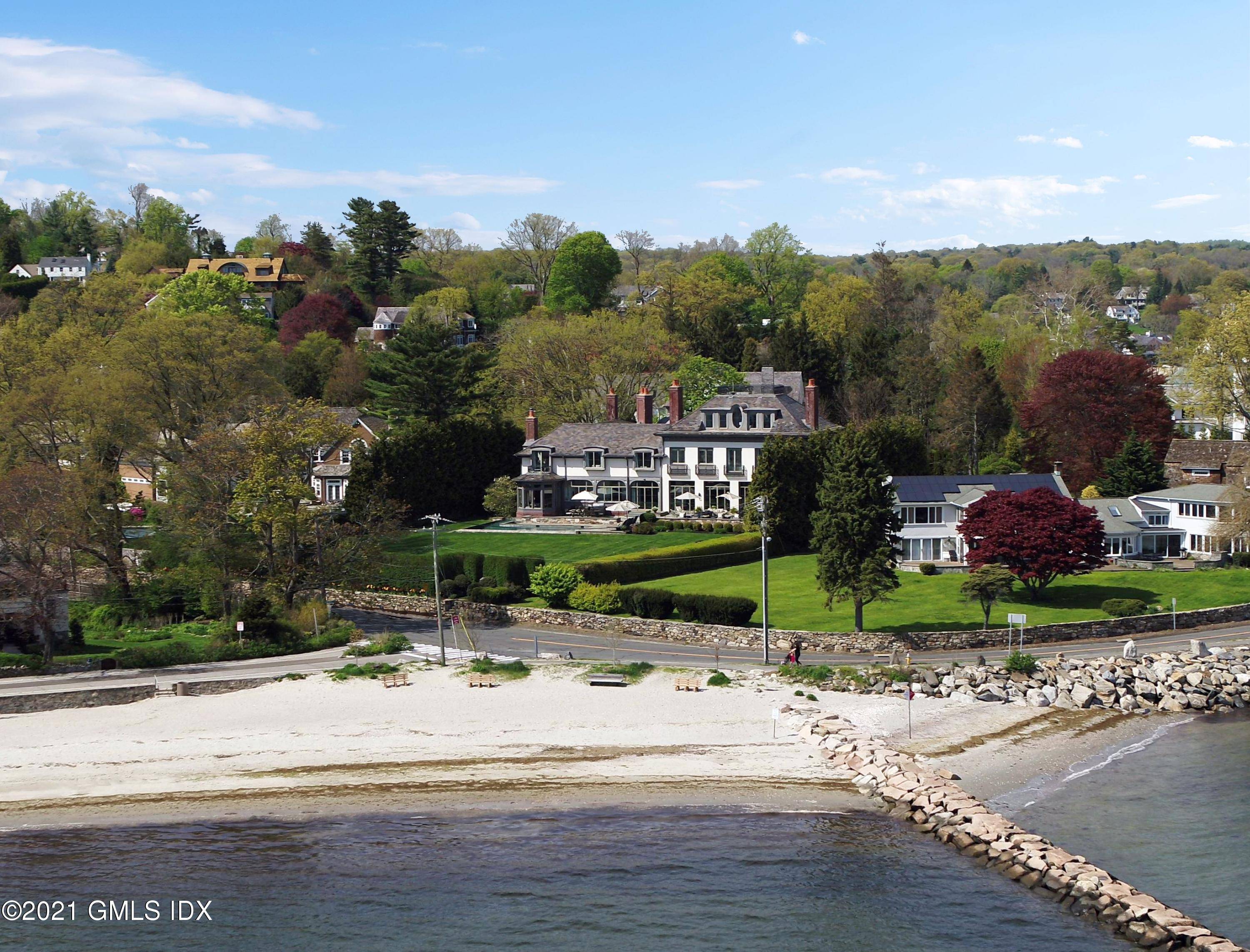 Exquisite Westport Compo Beach residence in the exclusive Blue Water Association offers a unique and masterfully executed blend of custom elegance with sophisticated architectural details for an extraordinary LI Sound ...