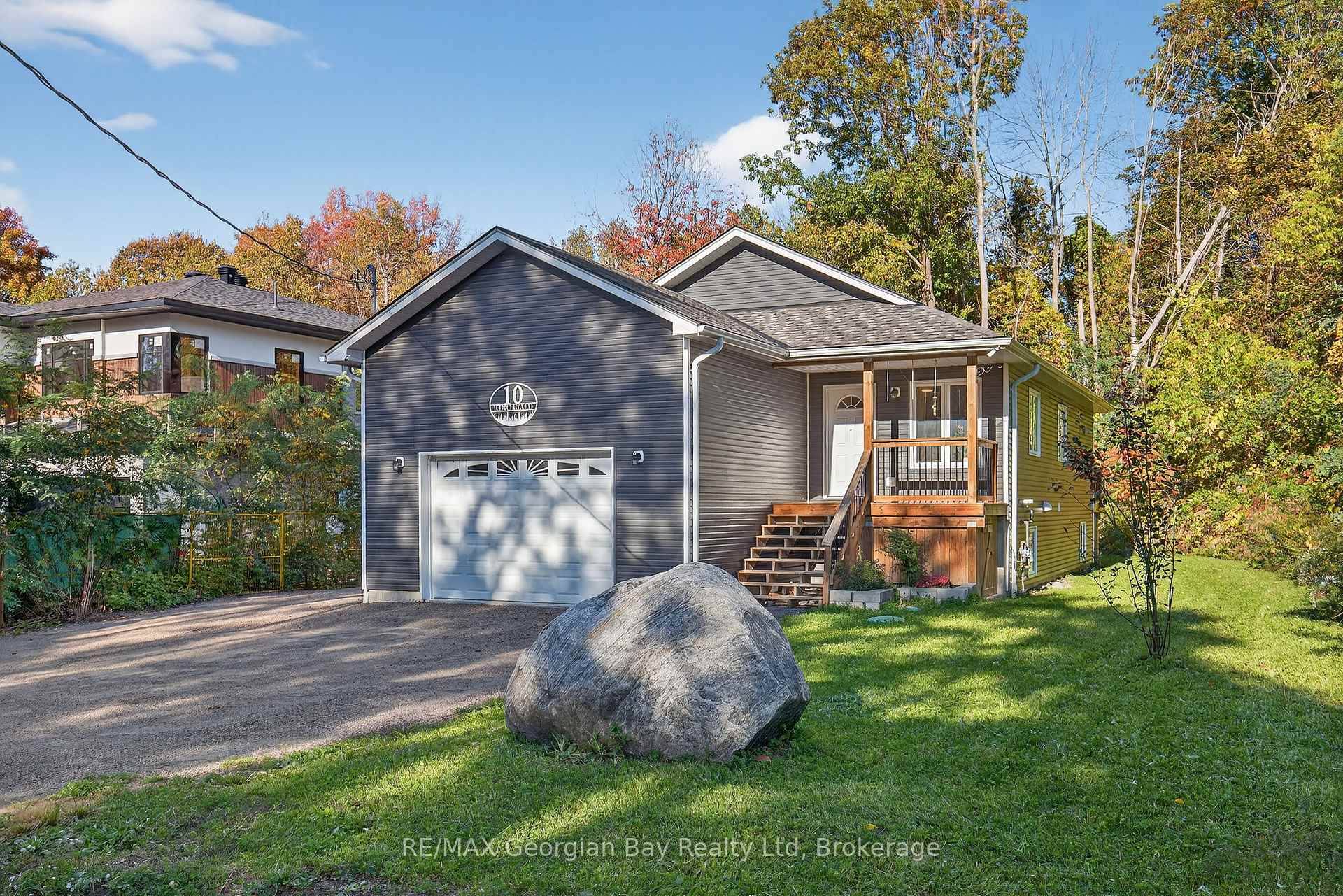 Purpose built 5 year old home with Apartment located on quiet street steps to Georgian Bay and the Tay Shore Trail.
