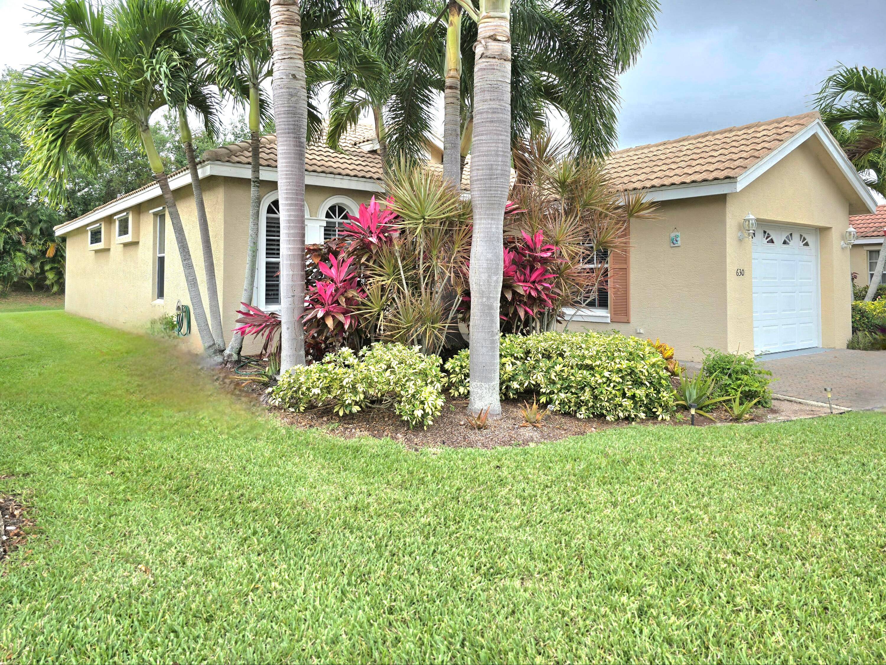 WOW. A Fabulous, Spacious, Spanish Tile Roof Home in St Lucie West, and highly desired Lake Charles Community.