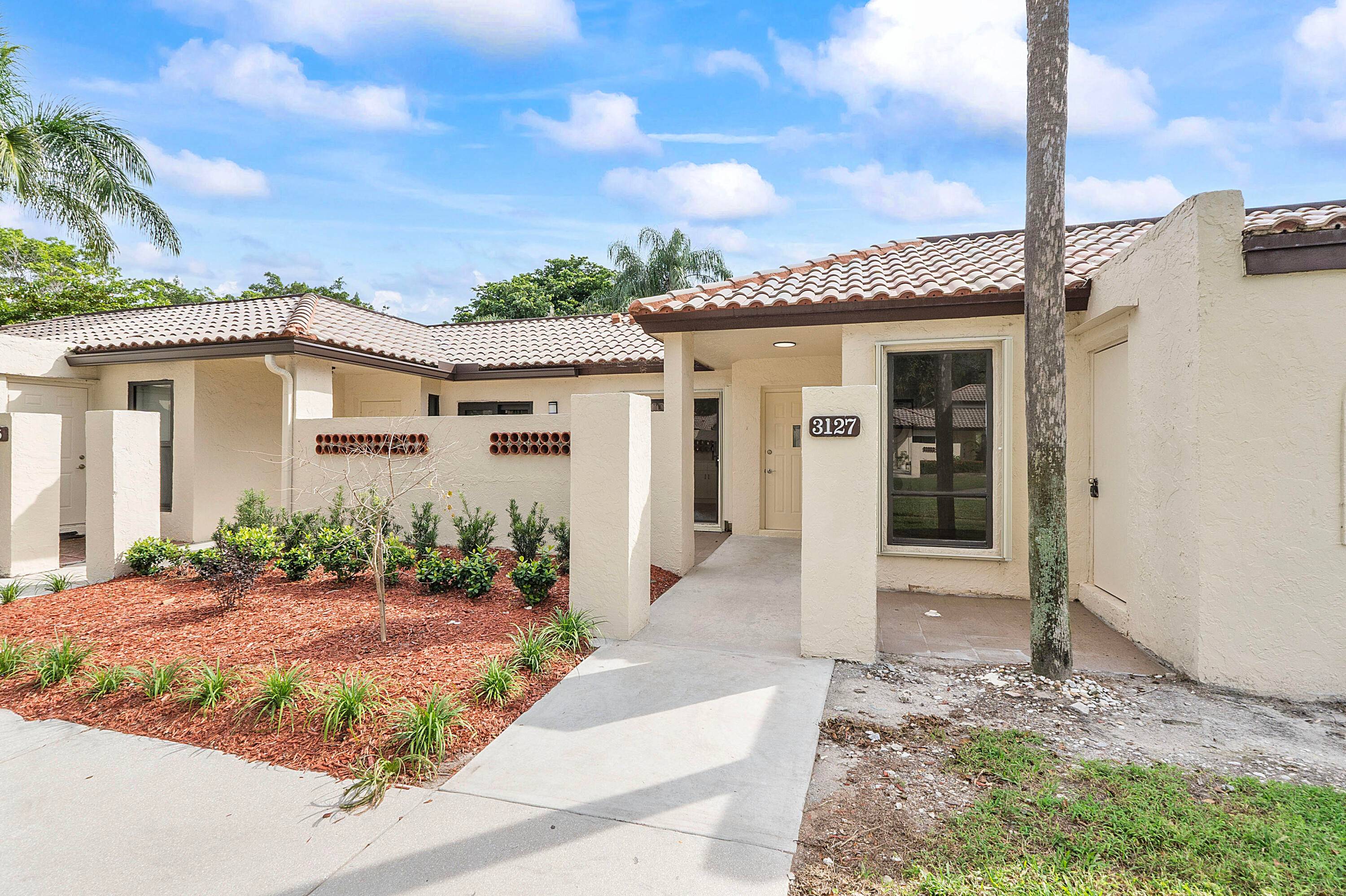 FULLY REMODELED VILLA IN EAST BOCA RATON'S GATED WINDWOOD NEIGHBORHOOD !