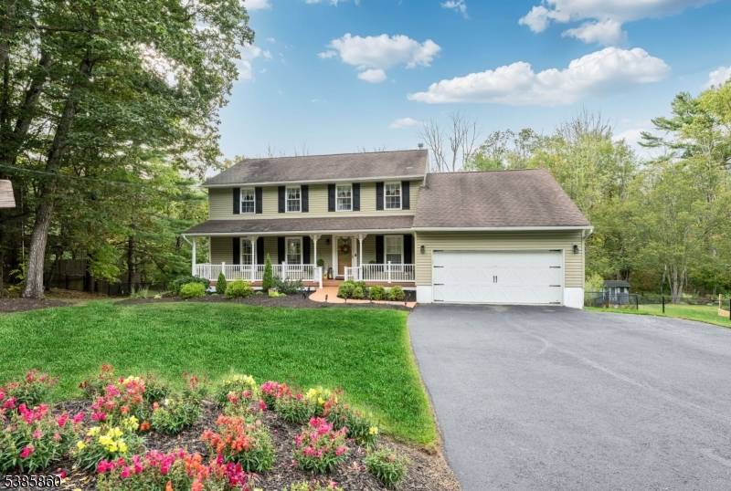 This beautifully maintained colonial home exudes timeless charm and modern comfort, offering an abundance of living space bathed in natural light.