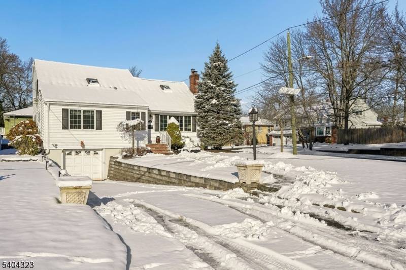Welcome to this expanded and thoughtfully renovated three bedroom, two bath Cape Cod, where classic charm meets modern comfort.