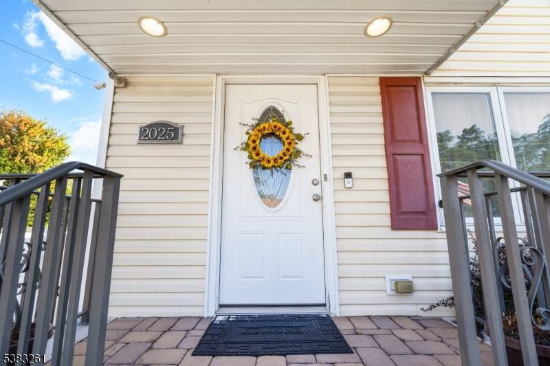 Welcome to this charming Cape Cod style home tucked away on a quiet South Plainfield street.