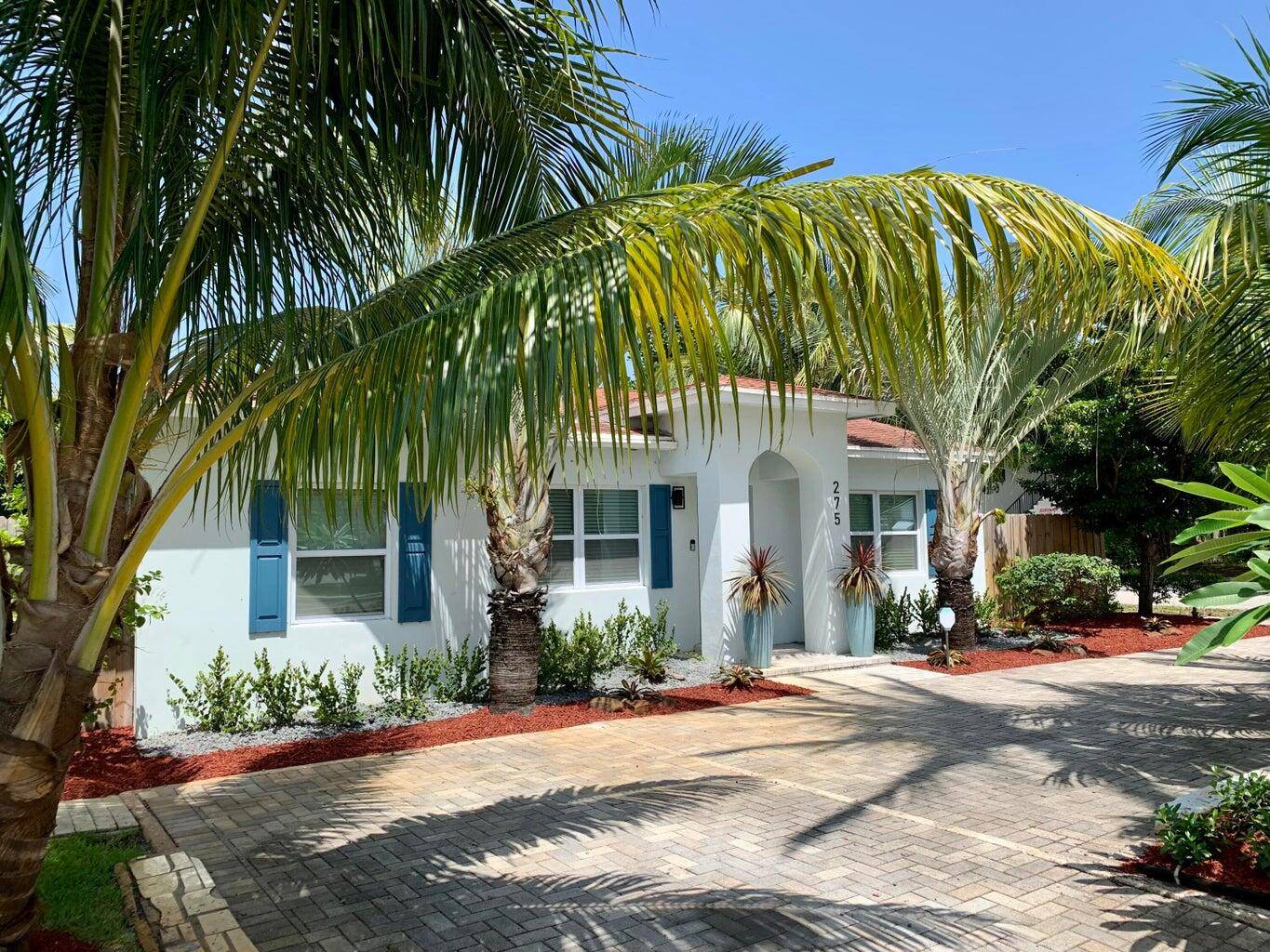 HUGE PRICE DROP FOR THIS STUNNING UPGRADED HOME WITH ALL THE BELLS WHISTLES NESTLED IN A BEAUTIFUL FENCED LUSH SPRAWLING PARKLIKE GARDEN WITH FRUIT TREES AND A SHED.